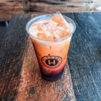 Thai Milk Tea  · Authentic Thai style tea topped with1/2 and 1/2  contains dairy.