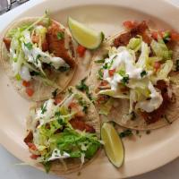 18. Fish Taco · Pescado. Cheese, sour cream, cilantro, lettuce, and salsa pico de gallo.