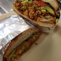 20. Torta Regular · Any meat, toasted Mexican sandwich with cheese, avocado, sour cream, tomatoes, and lettuce.