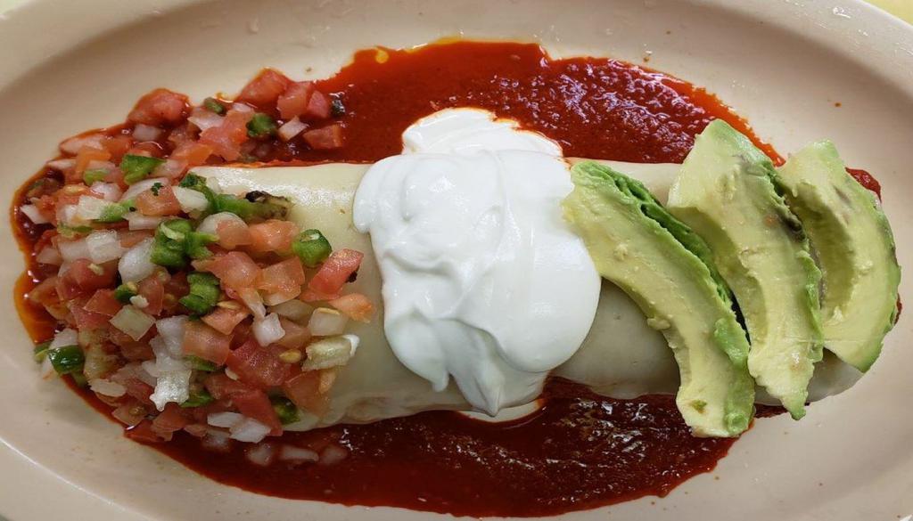 4. Wet Burrito · Any meat, rice, beans, onion, cilantro, melted cheese, sour cream, avocado, topped with red sauce.