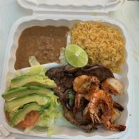 34. Camarones con Asada · One grilled steak and 6 prawns. Served with rice, beans, salad, and tortillas.