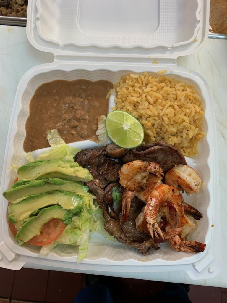 34. Camarones con Asada · One grilled steak and 6 prawns. Served with rice, beans, salad, and tortillas.