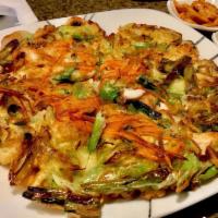 4. Hae Mul Pa Jeon · Korean style pancake with green onions, scallops and oysters.