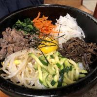 13. Dol Sot Bi Bim Bab · Mixed vegetable, beef and fried egg. Served in a hot stoneware.