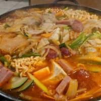 63. Bu Dai Jun Gol · Spicy stew with vegetables, ham, sausage, mushroom and kim-chi.