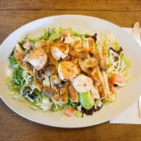 Azteca Salad · Grilled shrimp, chicken, and mushrooms over shredded lettuce, avocado slices, tomatoes and c...