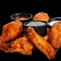 12 Wings · Chicken wings, hormone free, antibiotic free and 100% halal with choice of 2 sauces