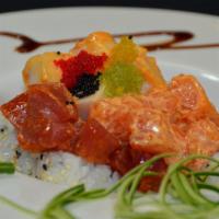 Fire Mountain Roll · Raw. California roll topped with spicy tuna, white tuna, salmon and 5 diﬀerent kinds of cavi...