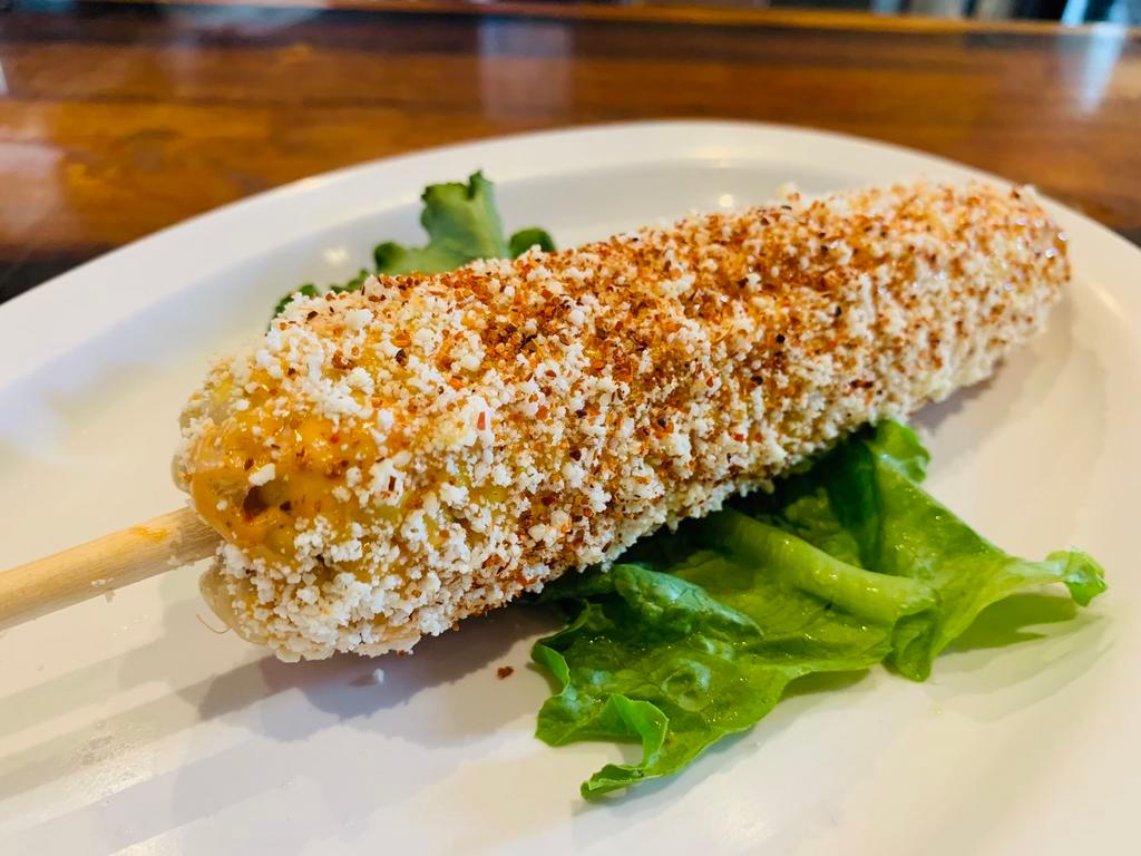 Mexican Street Corn · corn on the cob, chipotle mayo, Cotija cheese, Spicy Mexican seasoning.