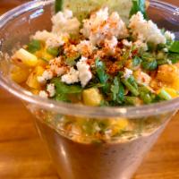 Mexican Street Corn Cup · Chipotle Mayo, Cotija Cheese, Cilantro, Lime, Spicy Mexican seasoning.