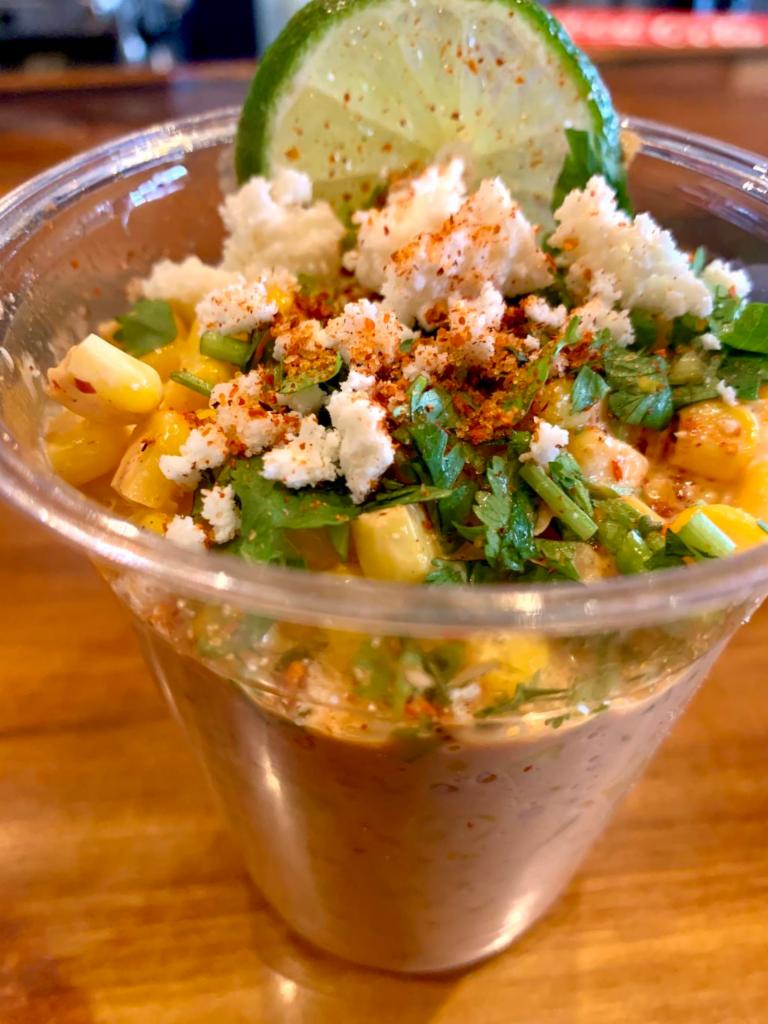 Mexican Street Corn Cup · Chipotle Mayo, Cotija Cheese, Cilantro, Lime, Spicy Mexican seasoning.