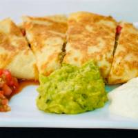 Quesadillas · Your choice of veggie, chicken, steak or shrimp... mixed with peppers and onions, Served wit...