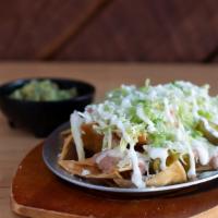 Super Nachos · Crispy homemade corn tortilla chips with melted cheese, refried beans. Guacamole, sour cream...