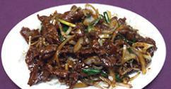 Mongolian Beef · Spicy. Sliced beef sauteed with green and white onion, garnished with rice noodles vermicell...