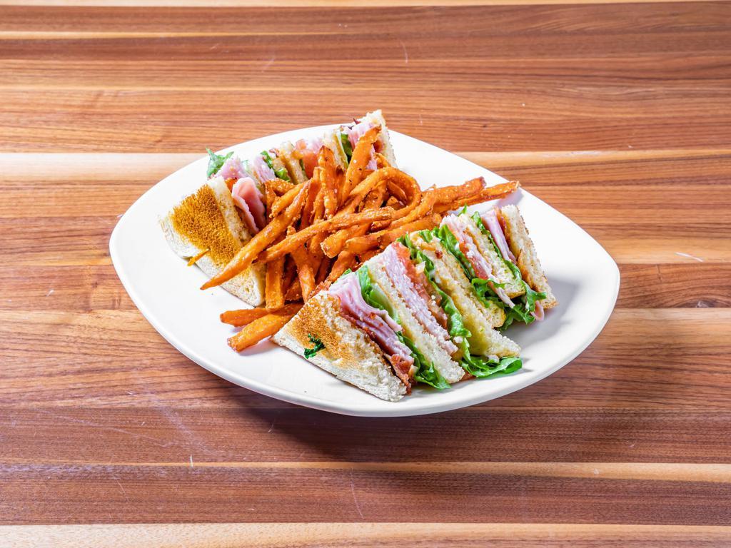 Club Sandwich  · Turkey, ham, bacon, lettuce, tomato and mayo on your choice of toasted bread.