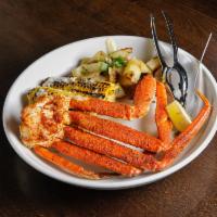 Grilled Snow Crab Legs · 1/2 lb of Crab Legs, grilled corn on the cob and roasted potatoes. Gluten free.