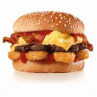 The Breakfast Burger · Charbroiled All-Beef Patty, Egg, Bacon, American Cheese, Hash Rounds®, and Ketchup on a seed...