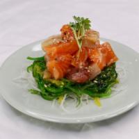 Mix Poke · Assorted Fish With Seaweed on Bottom Served with Spicy House Sauce Raw.