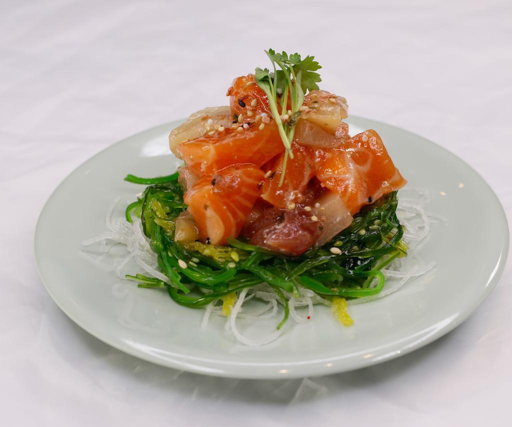 Mix Poke · Assorted Fish With Seaweed on Bottom Served with Spicy House Sauce Raw.