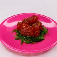 Tuna Poke · Tuna with Seaweed on Bottom Served with Spicy House Ponzu Sauce Raw.