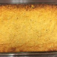 Cassava Pone · A baked desert item similar to bread pudding. The primary ingredients include flour, sugar, ...