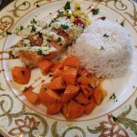 North Atlantic Grilled Salmon · Salmon filet drizzled with pomegranate molasses and basil cream served with confetti basmati...