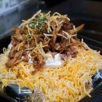 Famous Outlaw Potato · Each potato is over 1 lb. before toppings! Butter, cheese, sour cream, bacon, chives and a h...