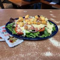 Big Salad · Lettuce, tomato, cucumber, onion, cheese, bacon, croutons and served with your choice of dre...