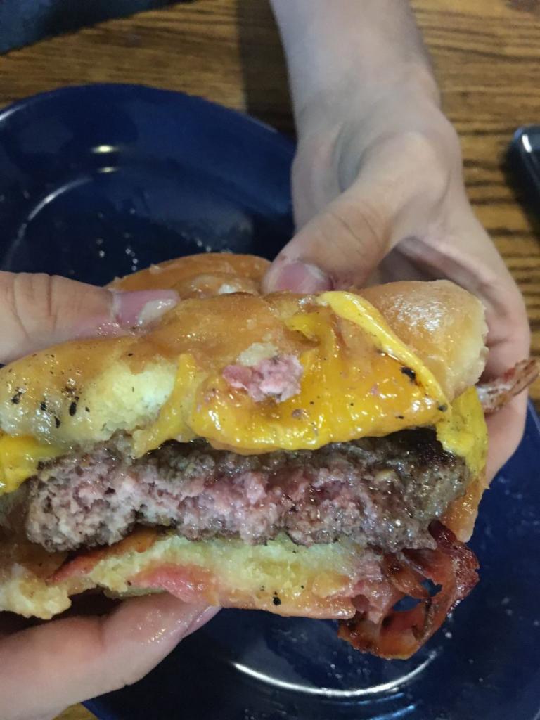 1/2 lb. Fresh Angus Burger with 2 Sides · Angus beef burger.
