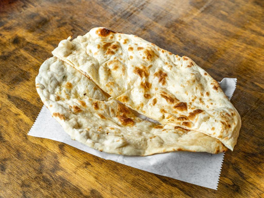 Plain Naan · Unleavened bread baked in tandoori clay oven. 