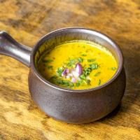 Tarka Dal · Lentil delicately tempered and seasonal with Indian herbs and garlic.  Served with basmati r...