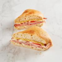 Ham & Cheese Melt · Black Forest ham, Swiss, Spicy Brown Mustard, and tomato toasted on ciabatta. Served with ch...