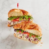Chicken Salad Sandwich · With spring mix and tomatoes on croissant. This product contains pecans. Served with choice ...