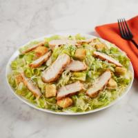 Grilled Chicken Caesar Salad · Romaine tossed with Parmesan and croutons, with Caesar dressing.