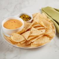 Nacho Basket · RO*TEL cheese dip, sliced jalapenos and tortilla chips. Vegetarian. 