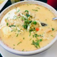 Chupe de Mariscos · Shrimp, octopus, mussels, squid, fish, rice, cheese, milk and egg soup.