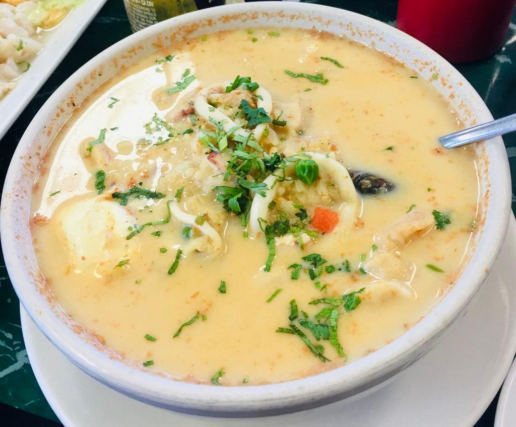 Chupe de Mariscos · Shrimp, octopus, mussels, squid, fish, rice, cheese, milk and egg soup.