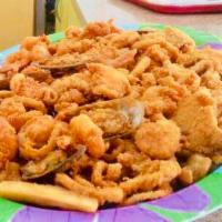 Jalea Mixta Familiar · Deep fried shrimp fish squid mussels and yucca Served with marinated onions ,diced tomatoes ...