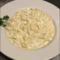 Fettuccini Alfredo Pasta · Fresh fettuccini noodles in creamy Alfredo sauce.