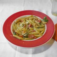 Chicken Florentine Pasta · Served with homemade pesto sauce, fresh spinach, pine nuts, tomatoes, white wine, and penne ...