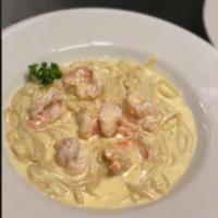Shrimp Fettuccini Alfredo · Fresh fettuccini noodles in a creamy Alfredo sauce and large fresh shrimp, for a seafood del...
