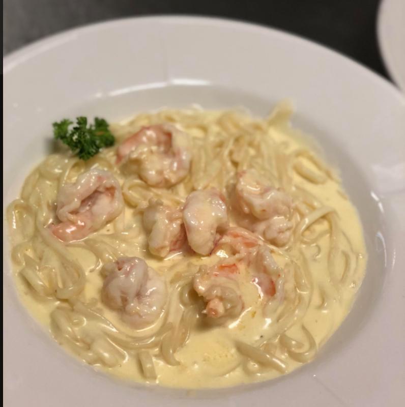 Shrimp Fettuccini Alfredo · Fresh fettuccini noodles in a creamy Alfredo sauce and large fresh shrimp, for a seafood delight.
