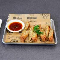 4 Pulled Pork Egg Rolls · Sauteed Asian vegetables mixed with smoked pulled pork. Served with garlic hot sauce for dip...