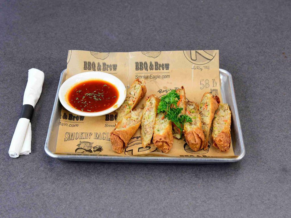 4 Pulled Pork Egg Rolls · Sauteed Asian vegetables mixed with smoked pulled pork. Served with garlic hot sauce for dipping.