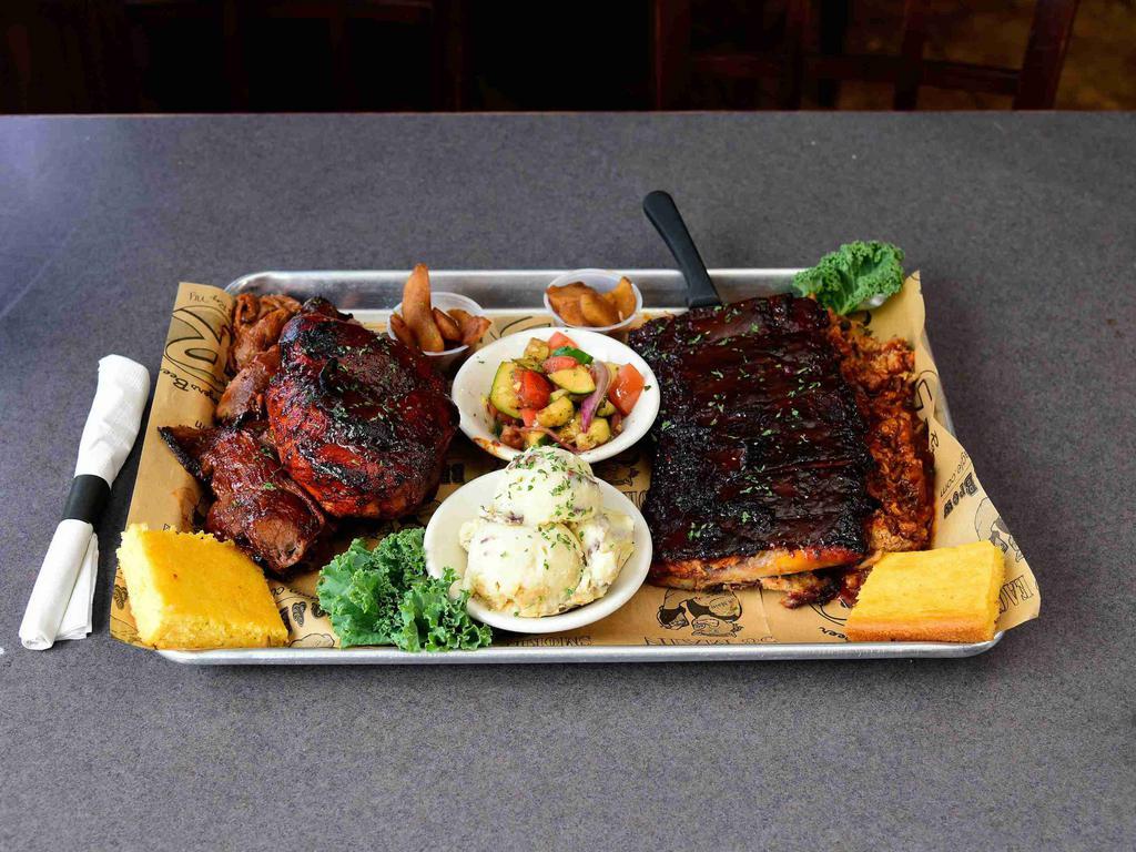 The Q for 2 · 1/2 rack of ribs, 1/2 chicken, and 1/2 lb of beef brisket, 1/2 lb. pulled pork, double cornbread and double baked apples.