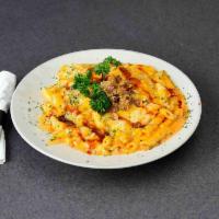Memphis Mac & Cheese · Slow smoked pulled pork tossed with pasta in our famous four cheese sauce and topped with se...