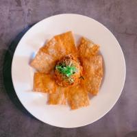 Fire Cracker · Spicy tuna mixed with tomatoes, onions and cilantro served with wonton crackers.