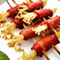 313. Bacon Wrapped Mushrooms Skewer · Grilled meat that has been cooked on a skewer. 