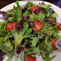 Insalata Mista · Mixed greens, cherry tomatoes, black olives and extra virgin olive oil with balsamic vinegar.