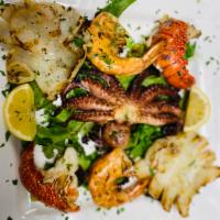Grigliata di Pesce · Lobster, octopus, calamari, shrimp and grilled vegetables.